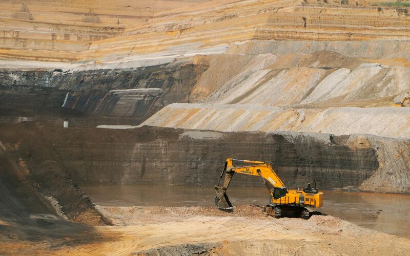 Excavator working in an open-pit mine